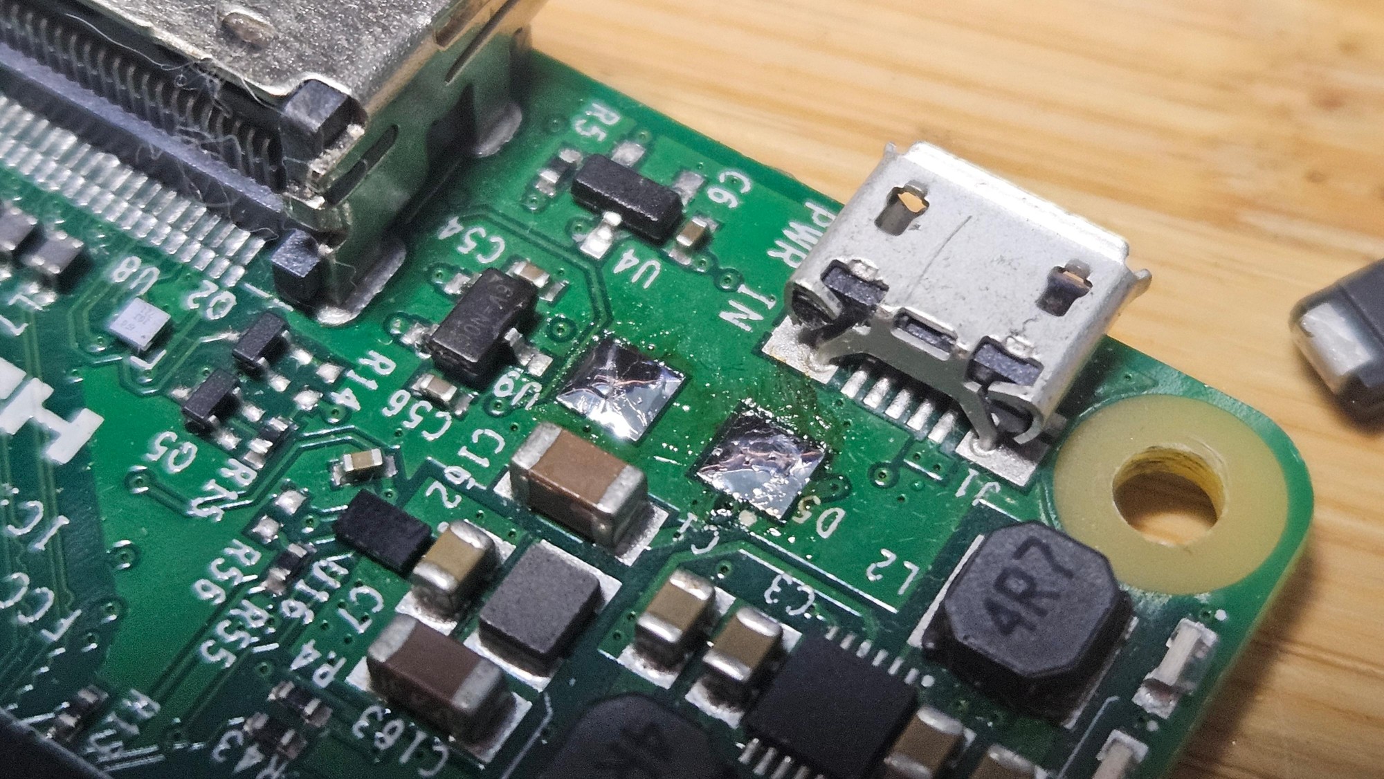 Diode removed and solder pads visible